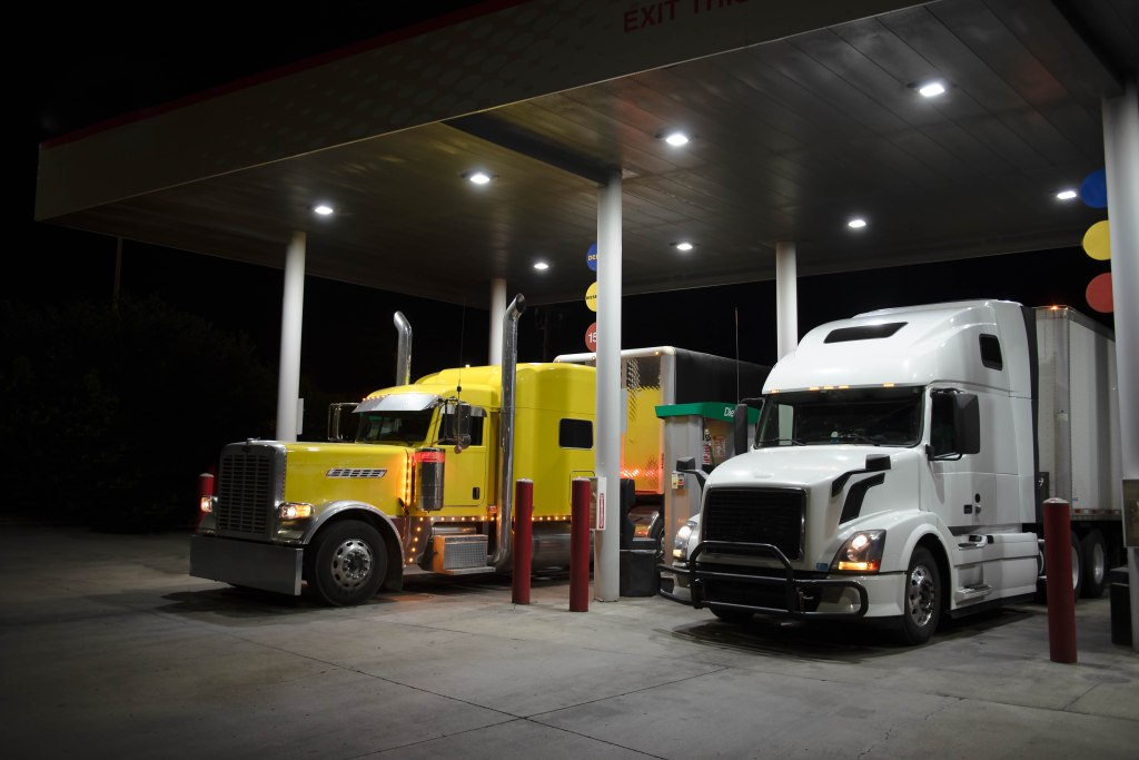 Classic and modern trucks fueling side by side